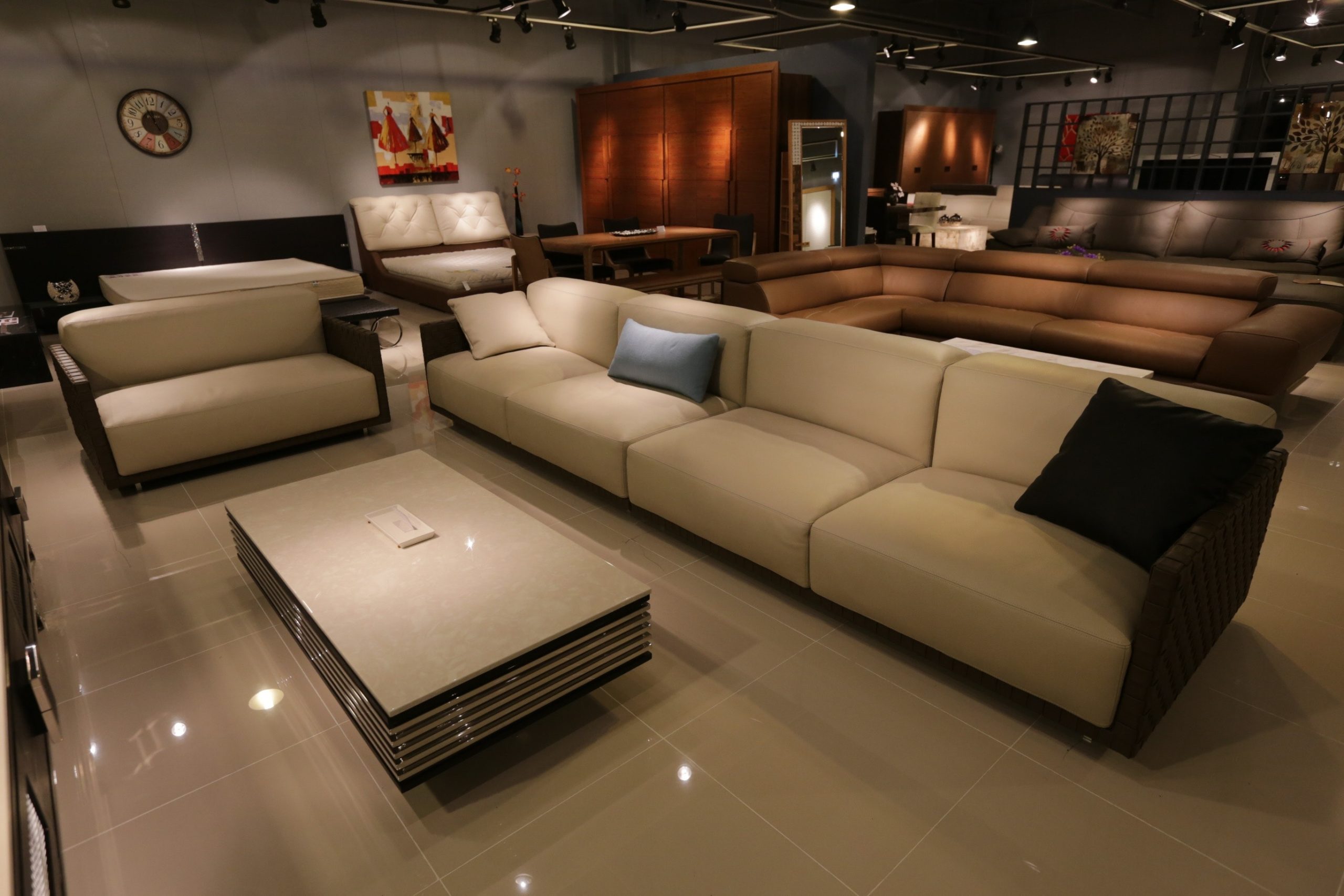 living room lighting, brown and beige leather couches with white ceramics and lighting